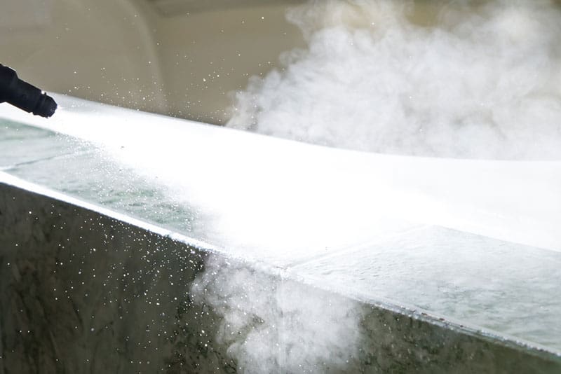 Steam cleaning equipment in action
