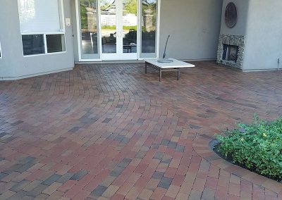 Sealed patio pavers with enhanced color and protection