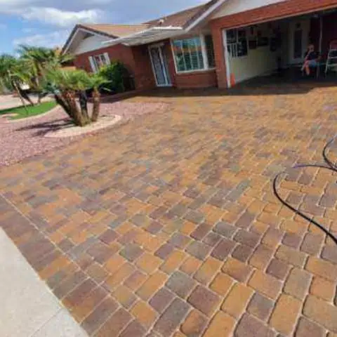 Paver pressure washing equipment in action